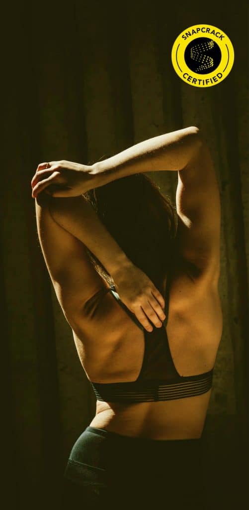 woman stretching her arms behind her