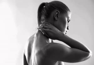 Women holding neck in pain