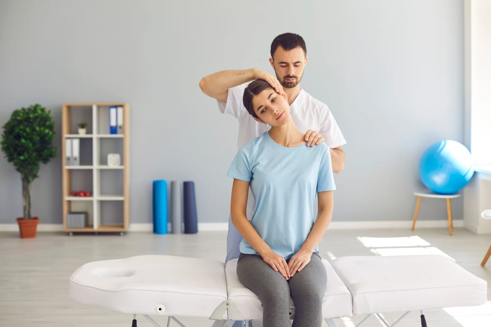 Photo of a Chiropractor Doing Stretch Massage