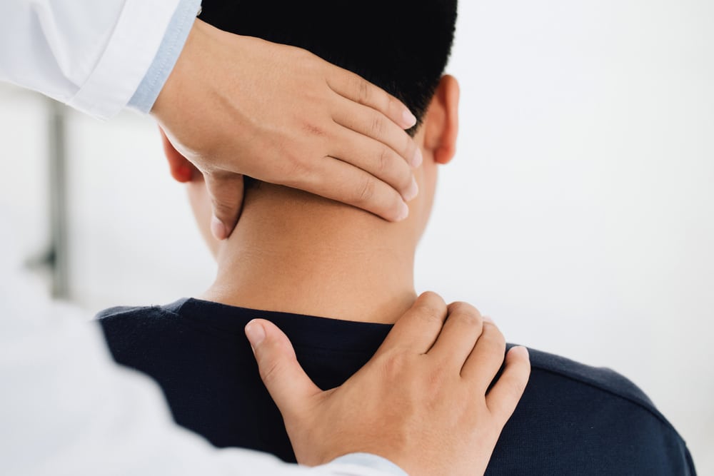 Photo of a Physiotherapist Massaging a Client's Shoulder