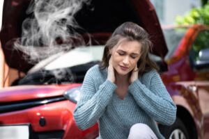 Woman Holding Her Neck After A Car Accident