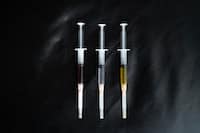 Three Syringes With Various Liquids