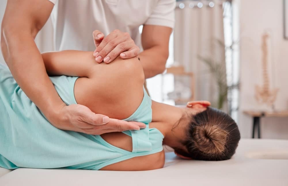 Chiropractic Adjusting A Patients Back