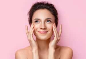 Smiling Woman Against A Pink background